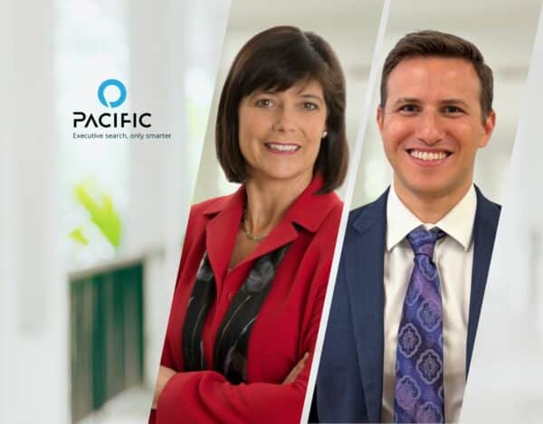 Two professionally dressed people, a woman in a red suit and a man in a blue suit, stand side by side. The Pacific logo and tagline “Executive search, only smarter” appear on the left.